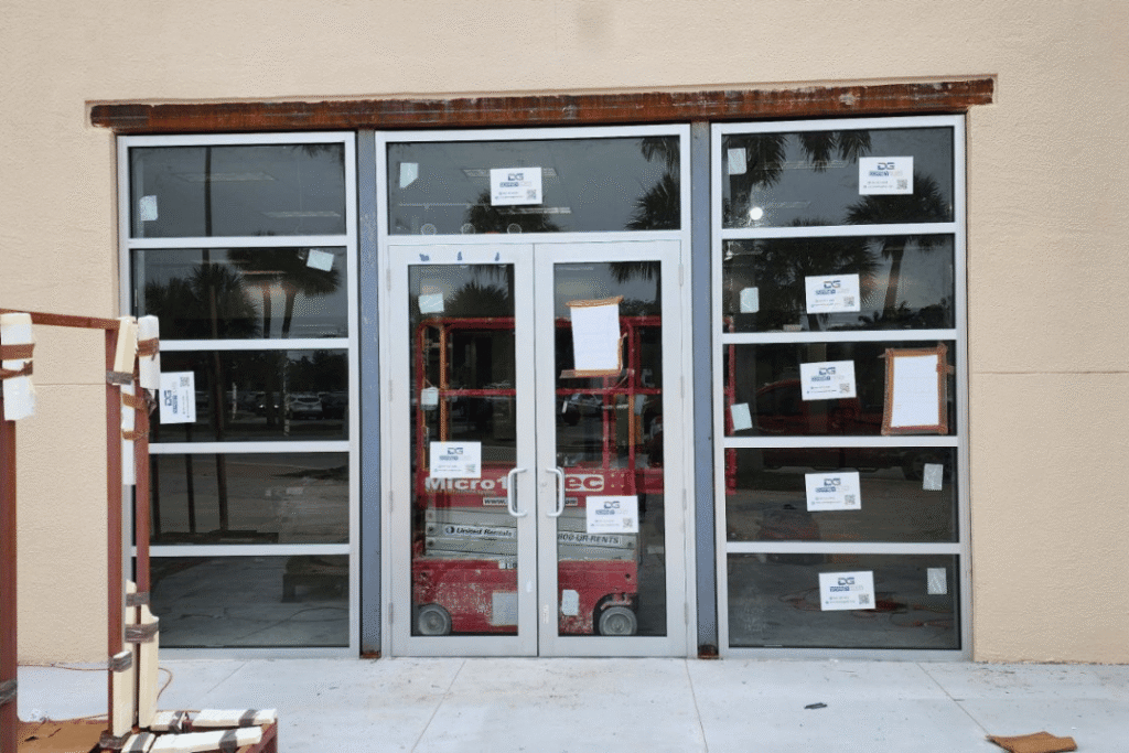 impact-rated glass entry doors with reinforced framing during installation