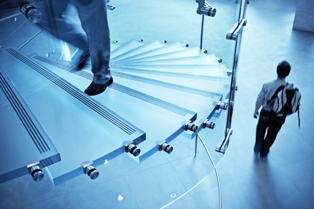 floating glass staircase with anti-slip treads and stainless steel fittings