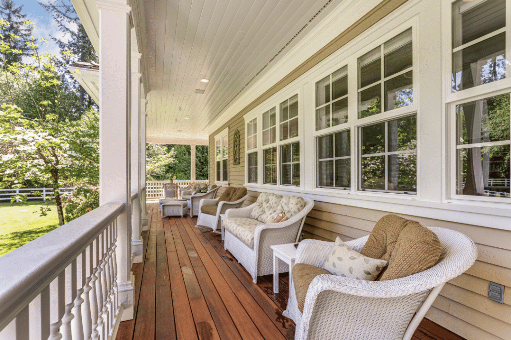 row of large residential impact windows along covered porch