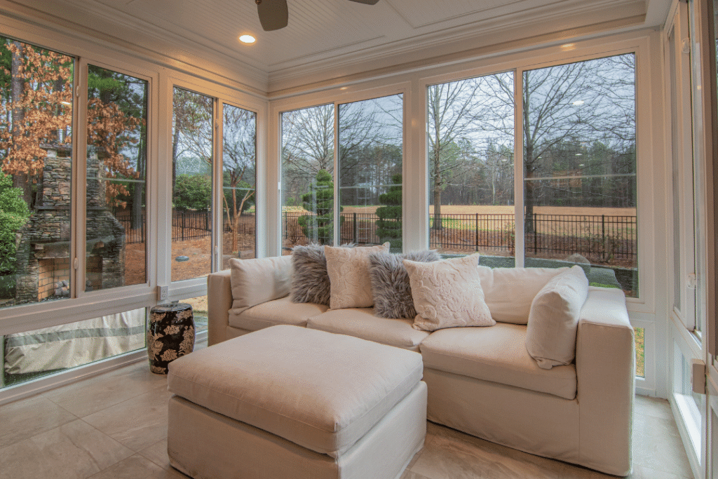 sunlit sitting area with floor-to-ceiling residential impact windows
