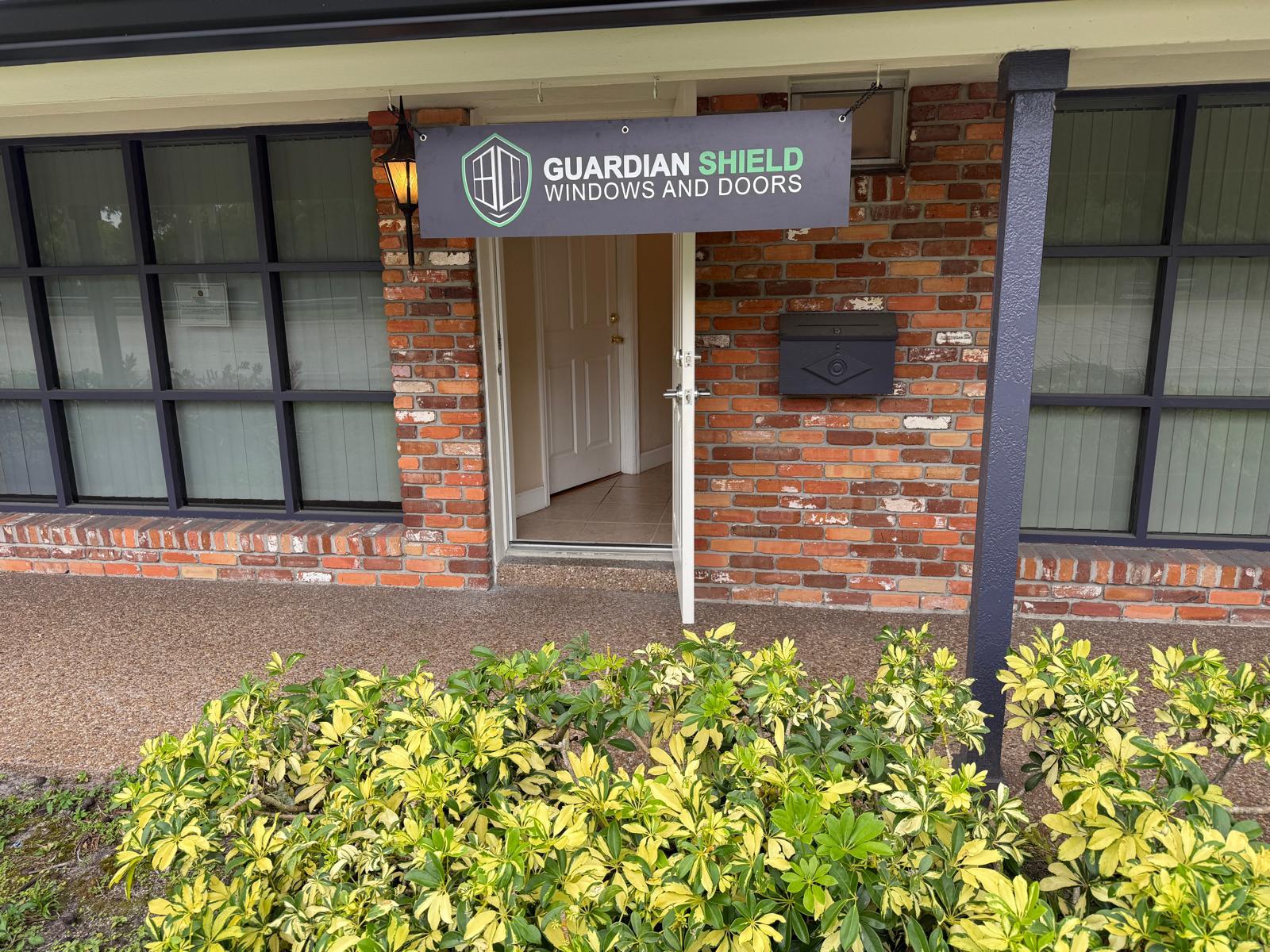 Guardian Shield Windows and Doors office entrance with branded banner at 7200 Griffin Rd, Davie, FL 33314