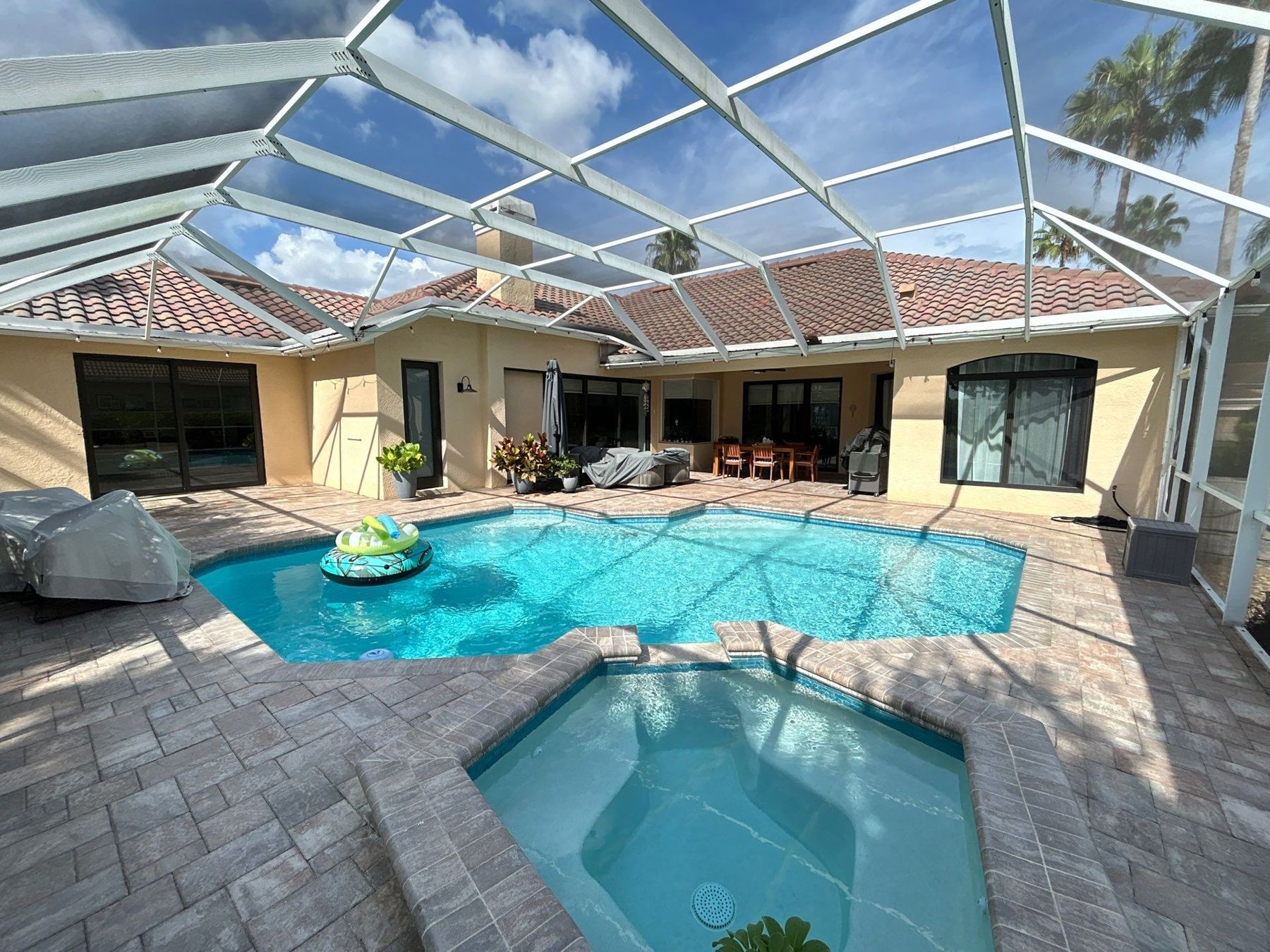Pool and lanai view with new bronze impact sliding doors